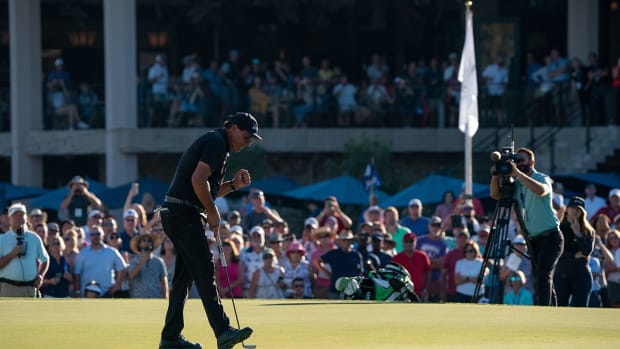 Phil Mickelson birdies the 18th hole at the Charles Schwab Championship.